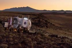 Render of NASA's Mars rover vehicle render on the surface of Mars.